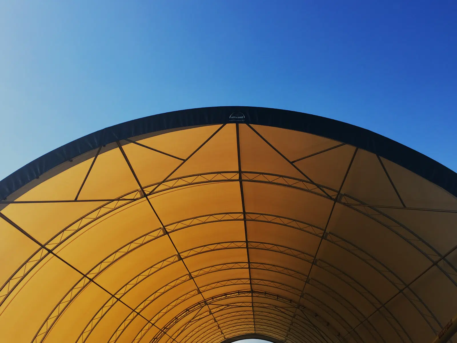 How Hail Protection Structures Help Dealerships Navigate New Hail Insurance Rules